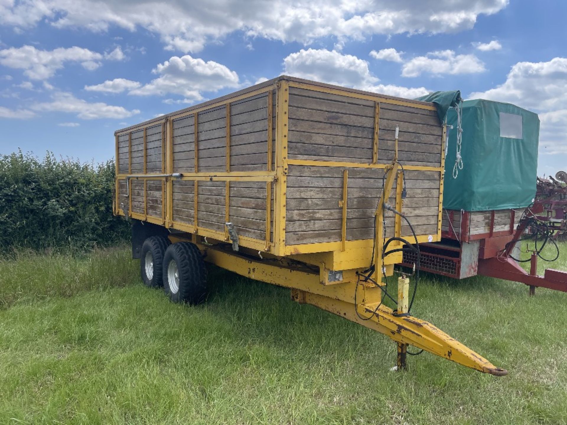 Yellow F&T 10t grain trailer with rollover sheet