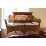A cane conservatory two seater sofa,