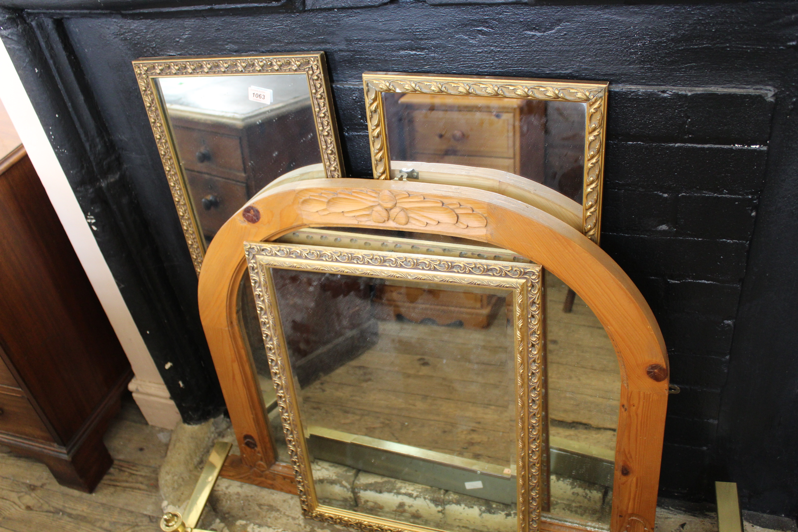 Three gilt wall mirrors and a pine overmantel mirror