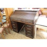 A c1940's oak roll top desk