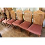 A set of six modern hardwood dining chairs including two carvers