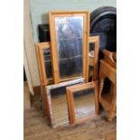Four assorted pine and gilt wall mirrors