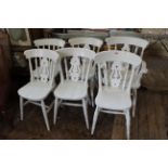 A set of six painted beech dining chairs including one carver
