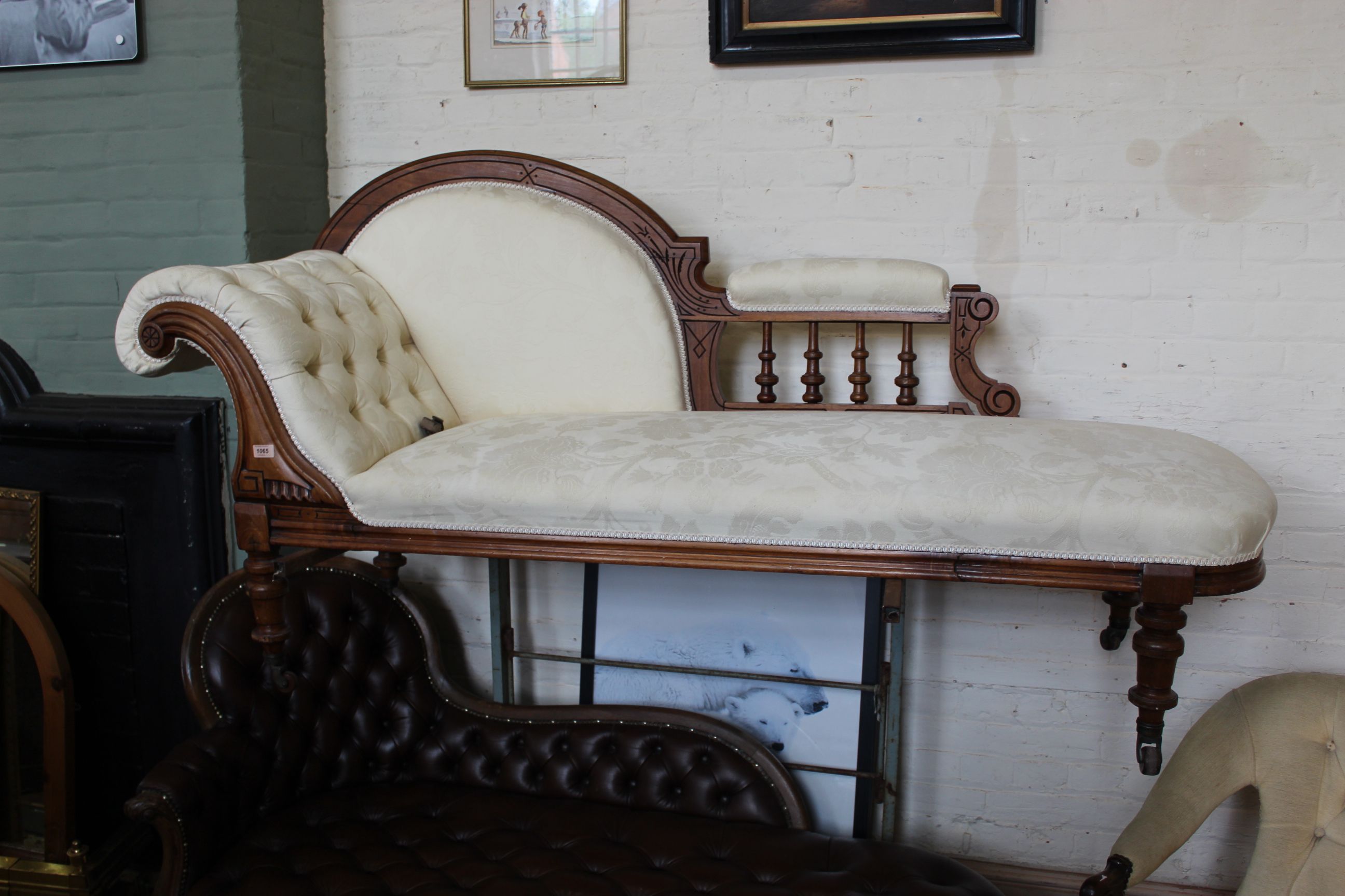 A late Victorian carved walnut upholstered chaise longue