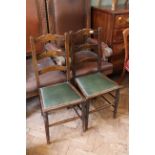 A pair of Edwardian oak chairs