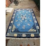 A large blue ground Chinese wool rug,