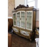 A large Italian style cabinet on four drawer base