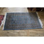 A blue and gold ground rug,
