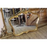 A decorative gilt framed wall mirror