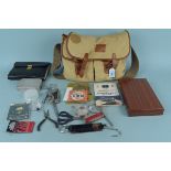 A House of Hardy canvas fly fishers bag containing a Hardy line,