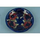 A Moorcroft 'Pansy' pattern shallow dish with blue signature to base, 18.