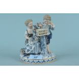 A Meissen figurine of a boy and girl with bird cage