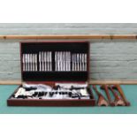 A Kingsway pattern cutlery set in canteen on legs with leather inset top
