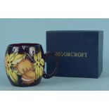 A boxed 2011 Moorcroft 'Chestnut' pattern mug,