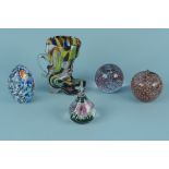 Two Murano glass paperweights plus two others and a Bohemian multi-coloured glass boot jug
