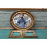 An oval gilt mirror plus two square empty gilt picture frames
