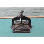 A vintage cast iron book press