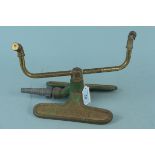 A vintage lawn sprinkler in brass and cast iron by Dron-Wal