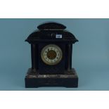 An early 20th Century black marble mantel clock of large proportions with gilt decoration