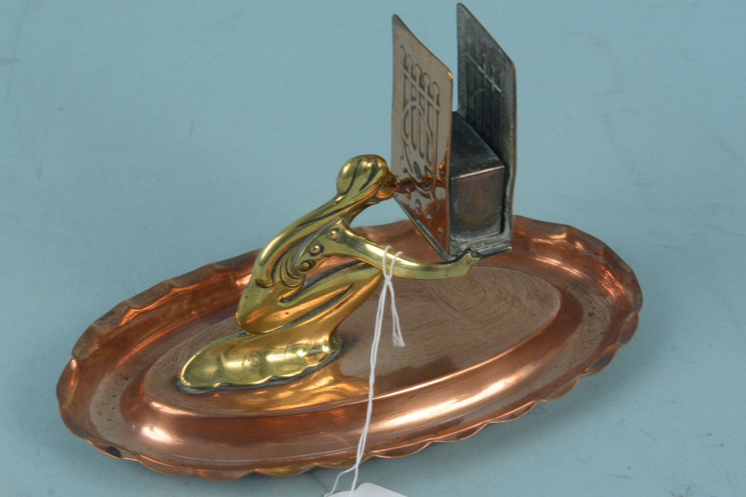 An Art Nouveau period copper and brass figural matchbox holder, 18.