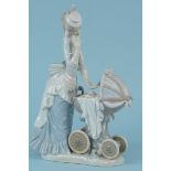 A large Lladro porcelain figurine lady with pram,