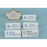 Five Royal Worcester porcelain advertising plaques, 12cm long plus a Royal Dux advertising plaque,