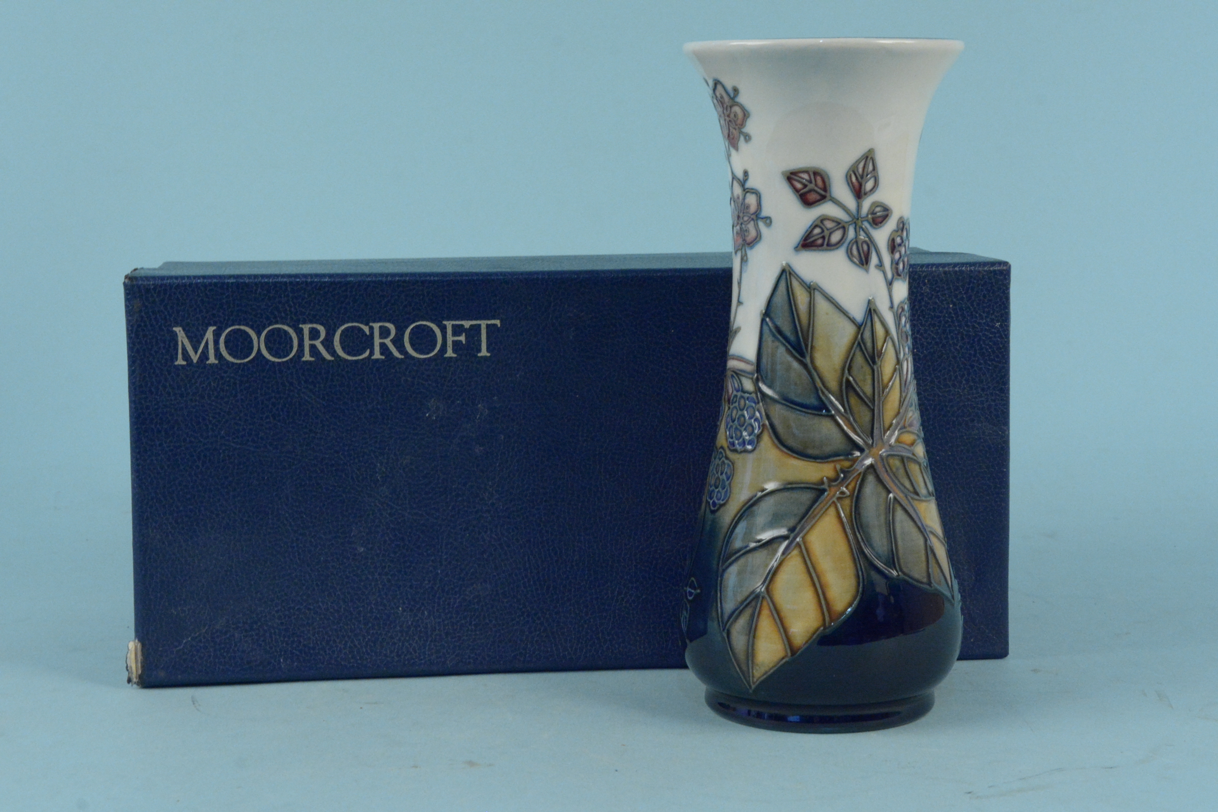 A boxed undated Moorcroft 'Bramble' pattern vase, 20.
