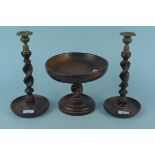 A pair of 1930's oak barley twist candlesticks with brass sconces plus an oak barley twist fruit