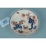 An 18th Century Lowestoft porcelain saucer decorated in colours in the two bird pattern,