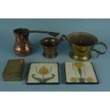 A brass scoop, a Middle Eastern coffee pot,