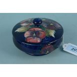 A Moorcroft 'Pansy' pattern lidded pot with impressed mark,