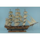 A 20th Century wooden model of a fully rigged warship