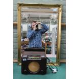 A 1950's Bakelite radio plus a gilt wall mirror