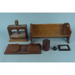 An oak book stand plus a sliding carved example, a wooden botanical press,