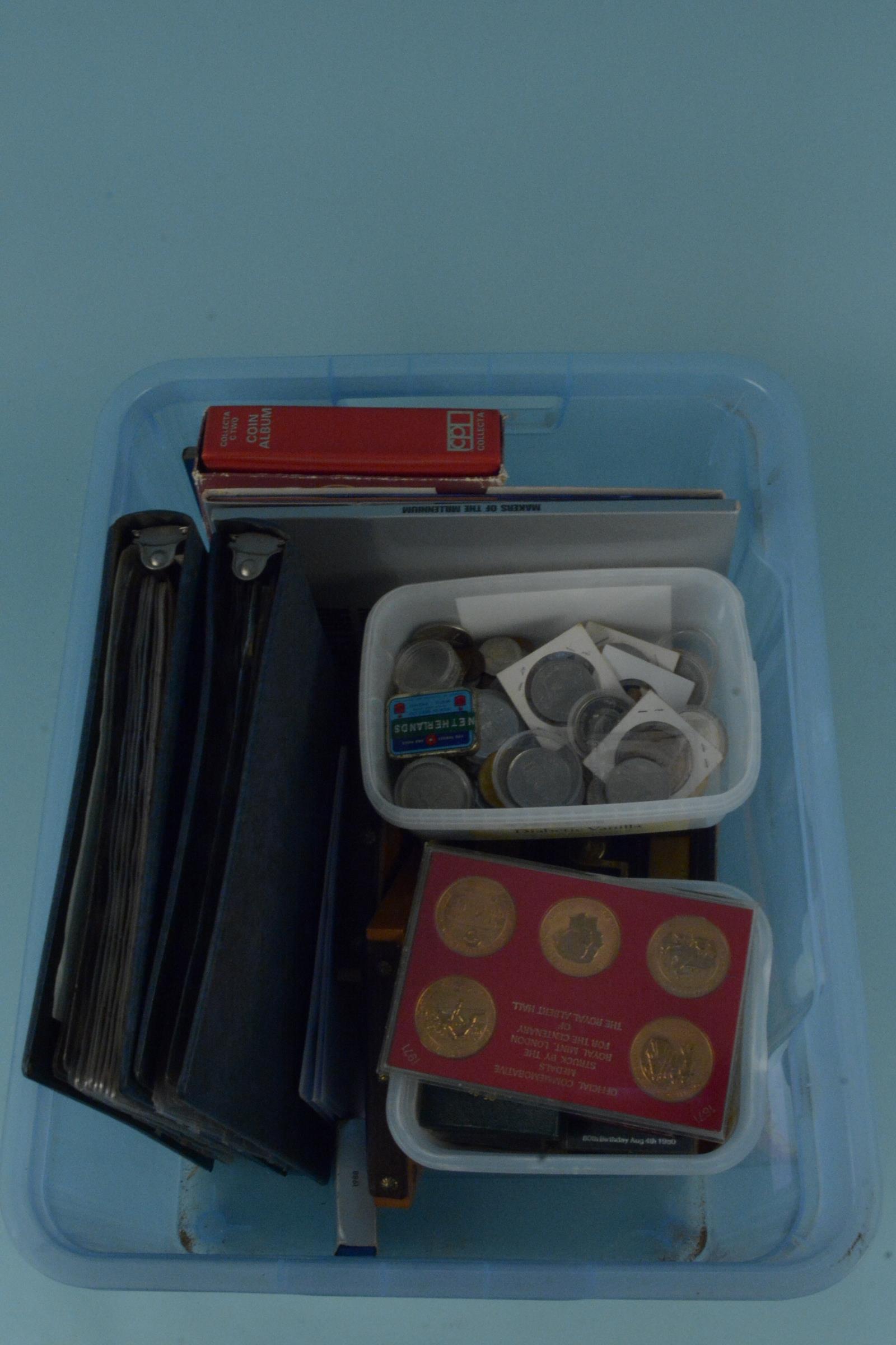 Mixed world and British coins in folders and loose with a lockable cash tin