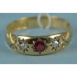 An 18ct gold diamond and red stone set ring, size P, weight approx 2.