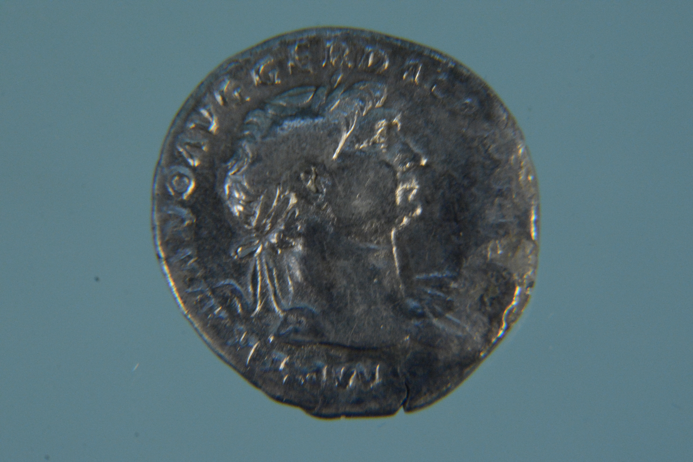 A silver coloured Roman coin (possibly Denarius) - Image 2 of 2