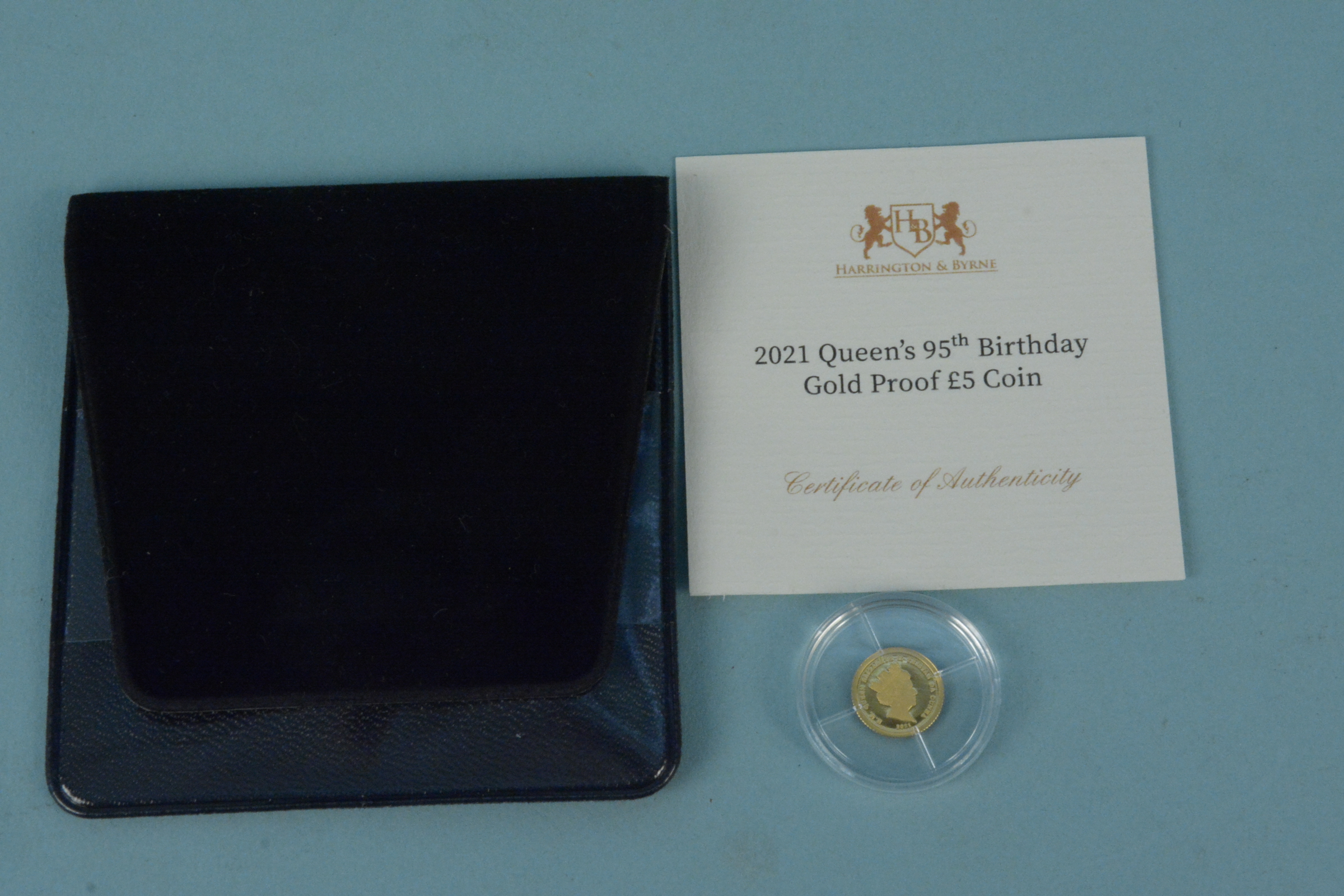 A 2021 Tristan da Cunha Queens 95th birthday 24ct gold proof £5 coin with certificate,