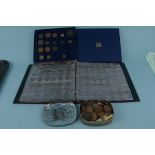 A folder containing British coins including some silver with old milled copper coins in a box plus