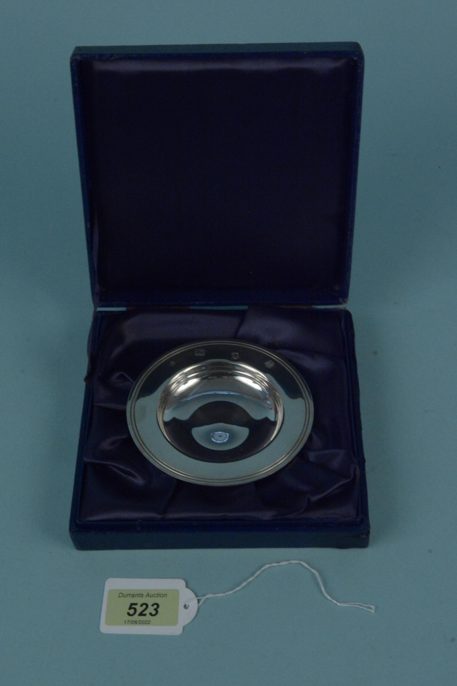 A cased silver Armada dish, hallmarked London 1988, maker William Comyns & Sons Ltd,