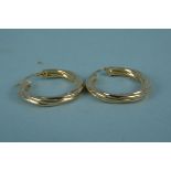 A pair of 9ct gold twisted design hoop earrings, weight approx 2.