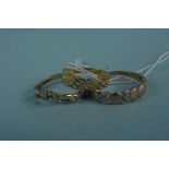 Three 9ct gold rings in various designs,