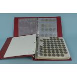 A folder containing commemorative coins including four 1996 Euro £2's,