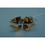 A pair of 9ct gold triangular tigers eye set cufflinks together with a pair of 9ct gold oval