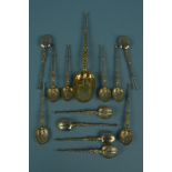 A set of twelve silver gilt anointing spoons together with a larger silver gilt anointing spoon,