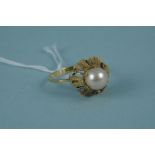 A continental yellow metal single pearl set ring size approx N 1/2,