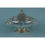 An American sterling table centre piece with silver plated pierced lid and pineapple finial,