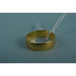 A 22ct gold wedding band, size M 1/2,
