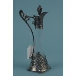 An Art Nouveau WMF liquor decanter with glass body metal base,