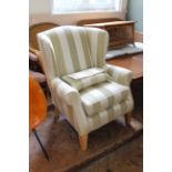 A modern upholstered Multiyork wingback armchair